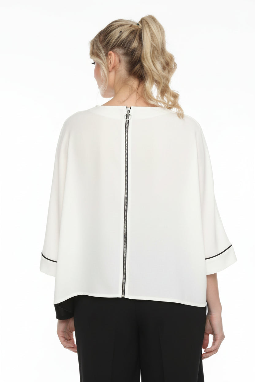 Woman wearing a white blouse with a black background
