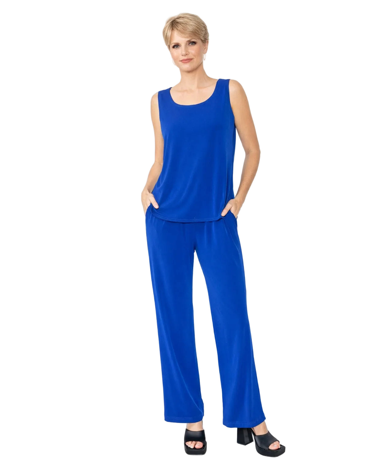 Woman wearing a royal blue matching
sleeveless top and pants on a white background