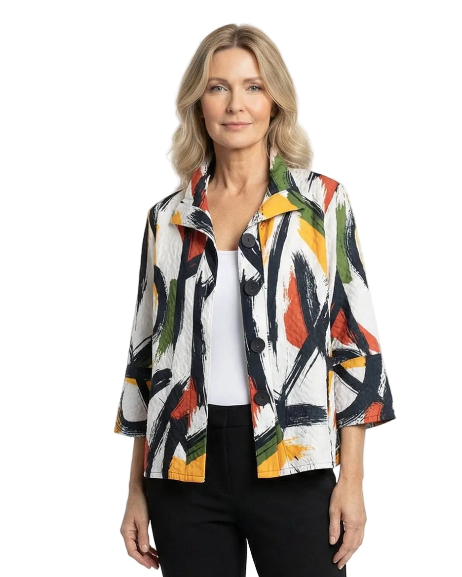 Woman wearing a colorful jacket and black pants on a white background