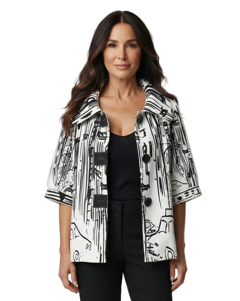 Woman wearing a black and white patterned jacket on a white background